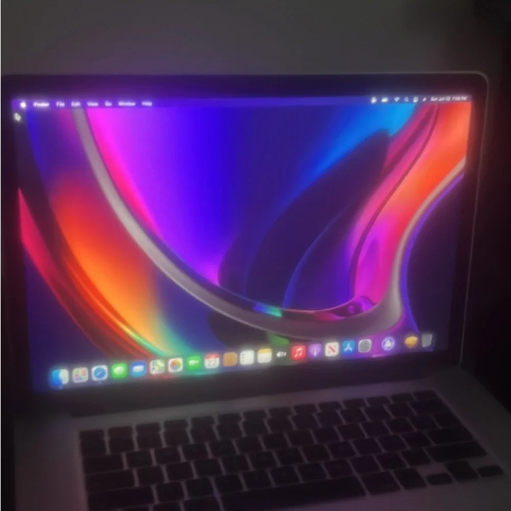 Apple Laptop with Red and Blue Keyboard Glow
